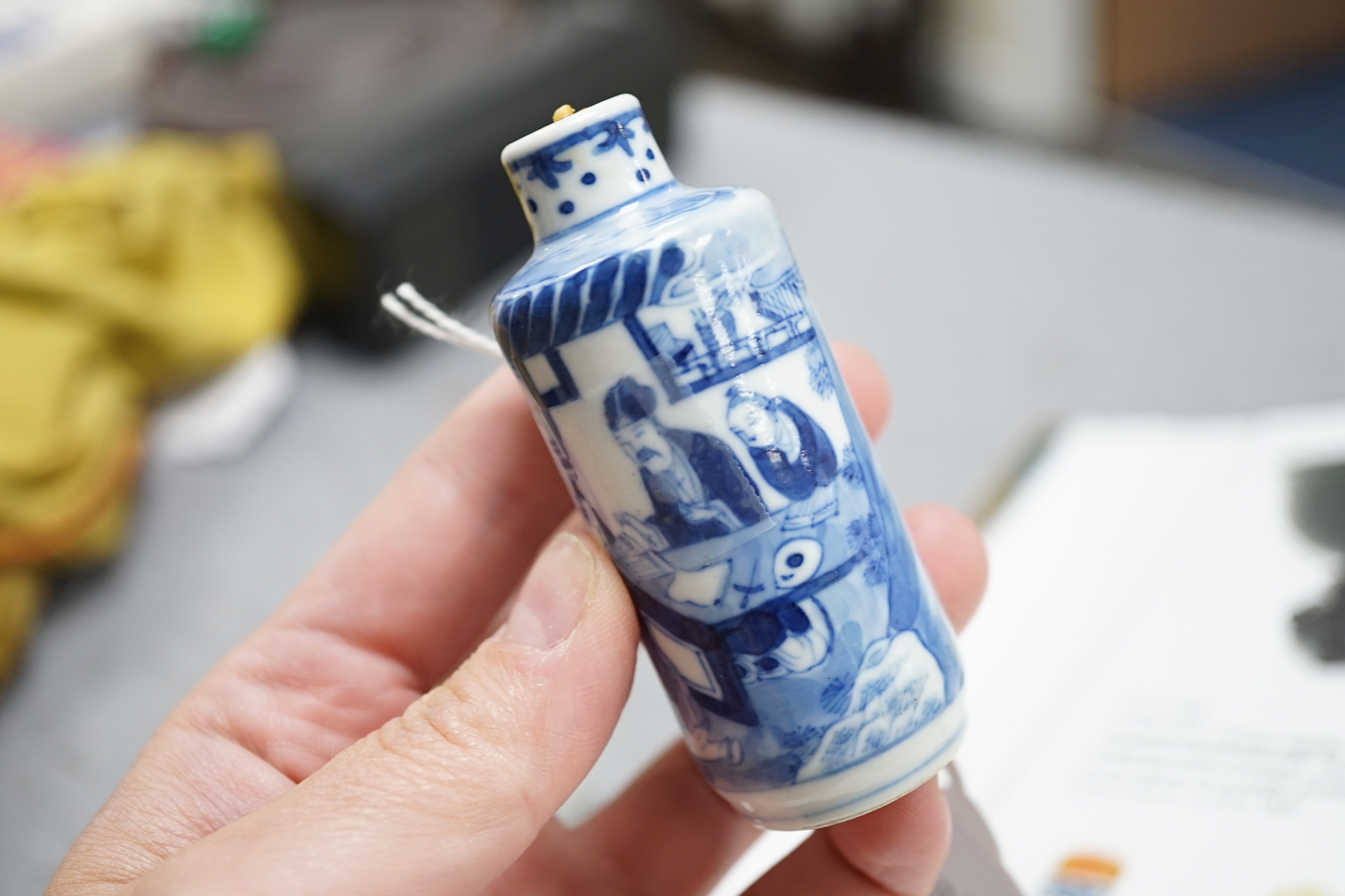 A Chinese iron red enamelled ‘dragon’ snuff bottle, Tongzhi mark and of the period (1862-74), together with two Chinese blue and white cylindrical snuff bottles, 19th century